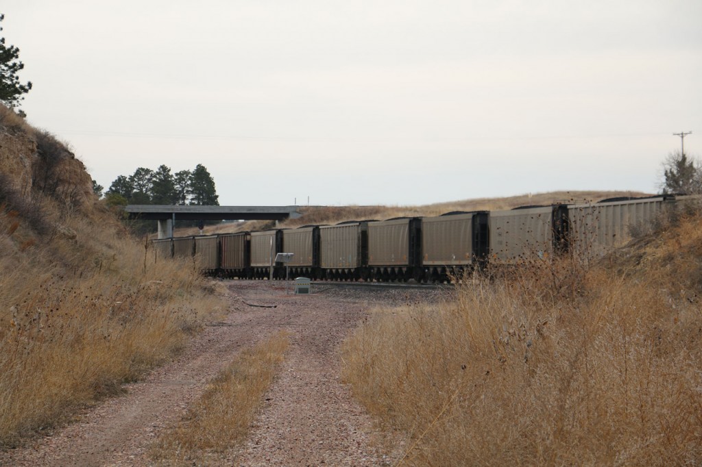Coal cars pass by the old Belmont Tunnel track.